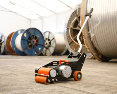 Battery roll pusher for the paper, corrugated, converting, wire and rubber industries